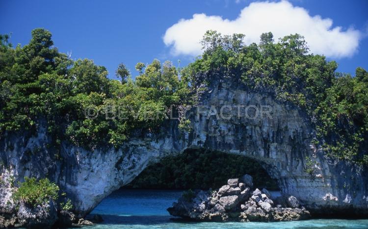 Island;Palau;arch;rocks;green;trees;blue water